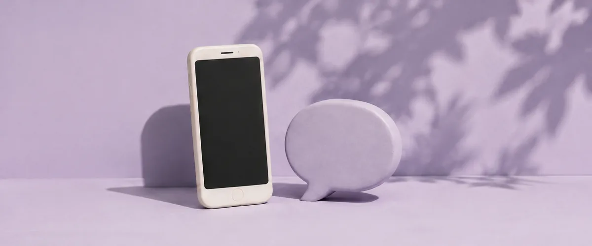 Phone and chat bubbles on a lavender background